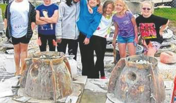 Girl Scouts pose in fron of Reef Ball Molds